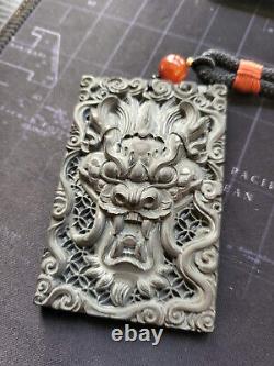 Carbon Fiber Dragon Head Amulet